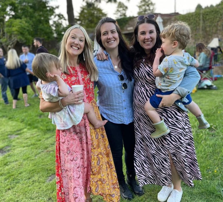 Molly with clients, holding their children, after a naming ceremony in Chester.