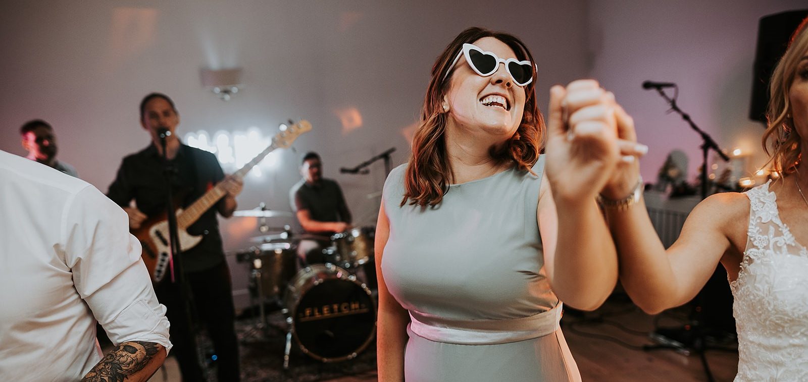 Molly, celebrant and founder of Molly’s Ceremonies, dancing with joy at a wedding reception with live music