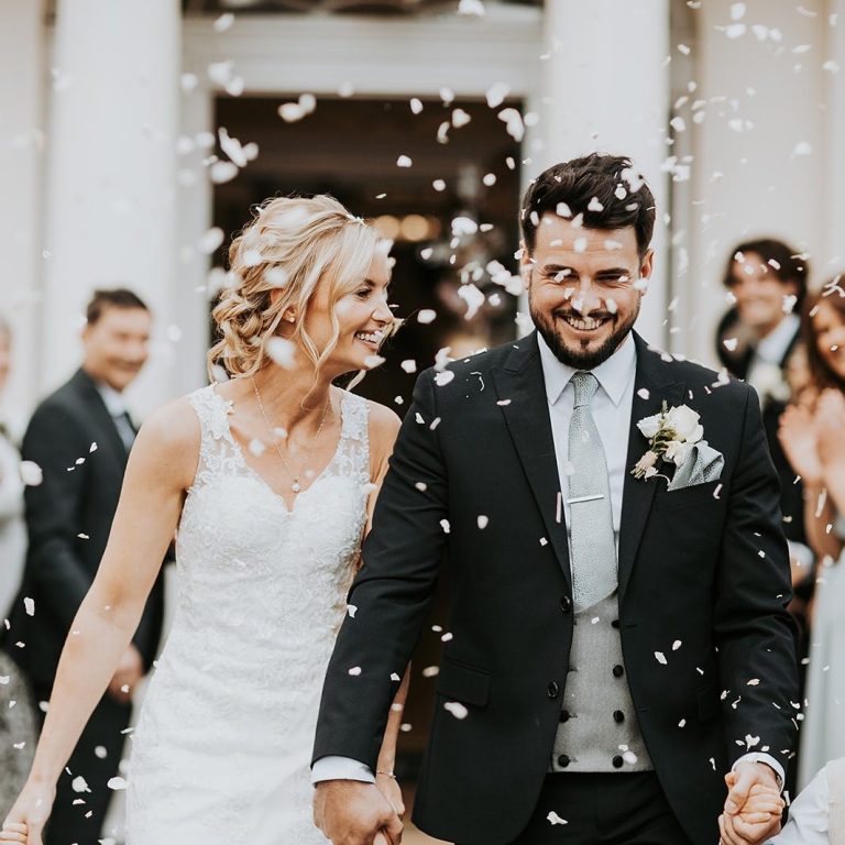 Happy couple walking down the aisle after their wedding ceremony with Molly’s Ceremonies